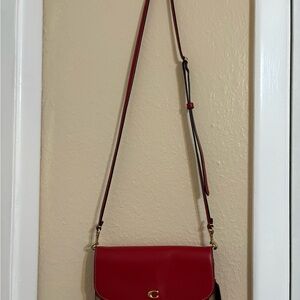 Coach Red Crossbody Bag with Adjustable Strap and Flap Closure